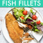 breaded fish on a plate with a side of salad