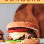turkey burger with cheese and tomato on a plate