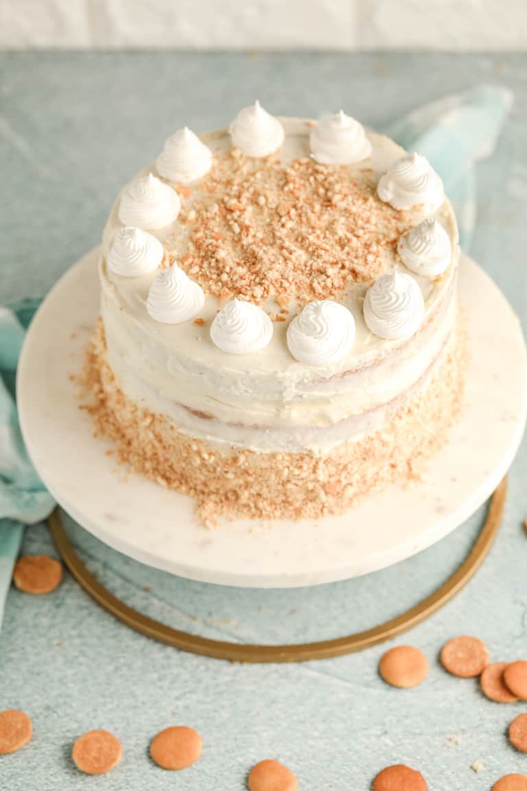 the completed banana pudding cake set on a cake stand
