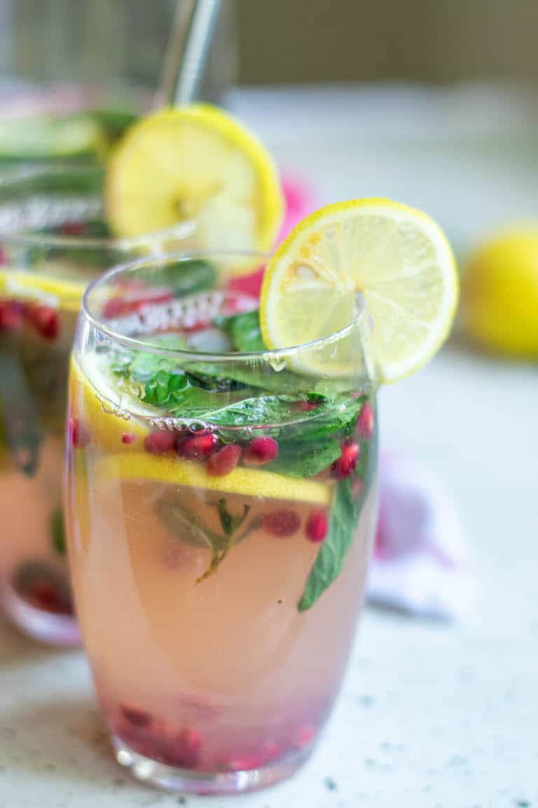 two glasses of bourbon lemonade garnished with lemon slices