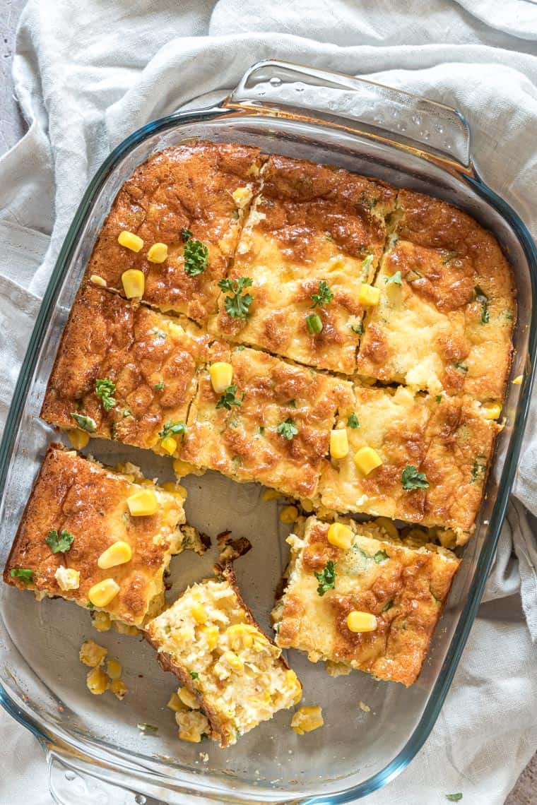 top down view of corn pudding casserole sliced and ready to serve
