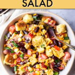 Cornbread salad in a serving bowl with a spoon