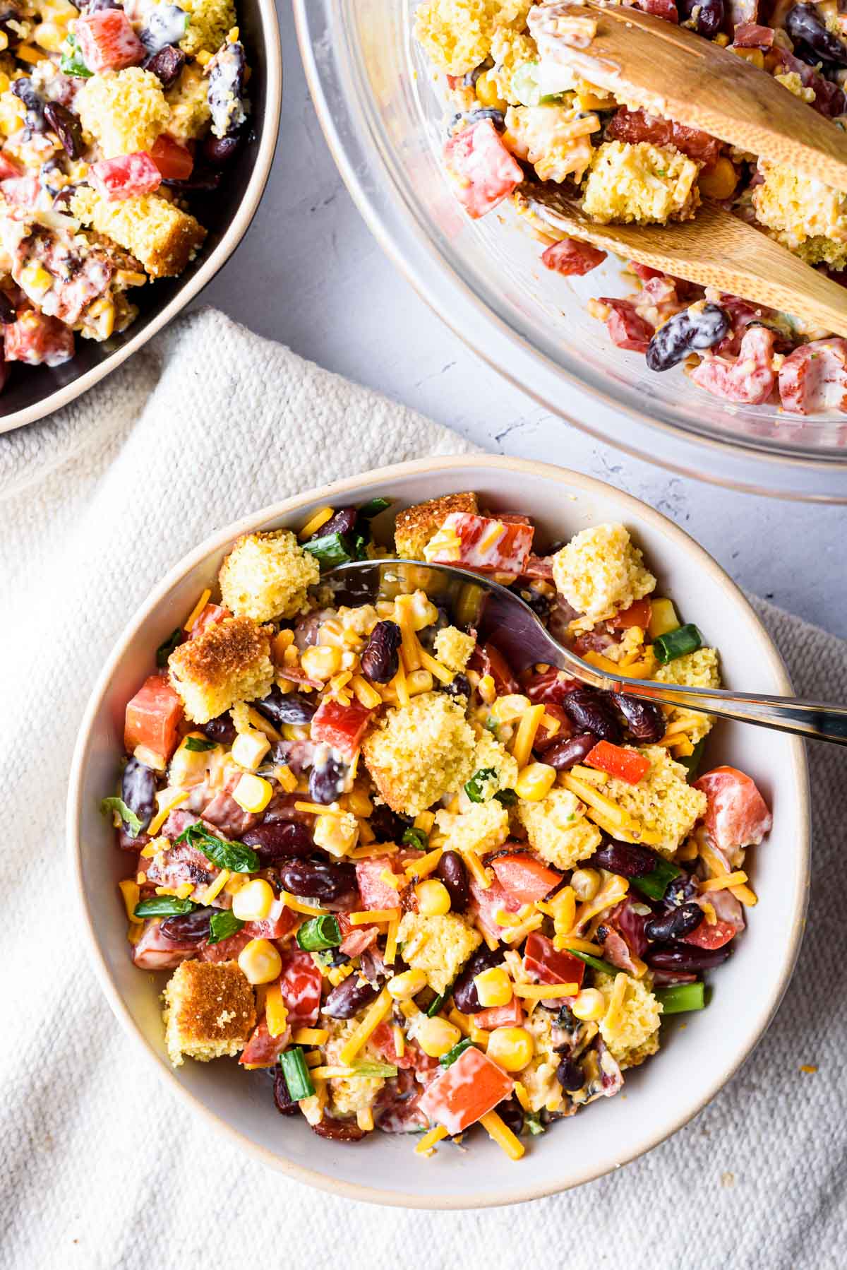 the completed cornbread salad recipe served on a ceramic bowl