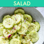 Close up of cucumber salad in a ceramic bowl