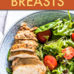 sliced chicken breast on a salad in a round bowl
