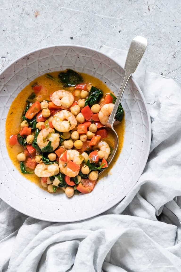 Thai Red King Prawn Curry in a bowl with a sppon
