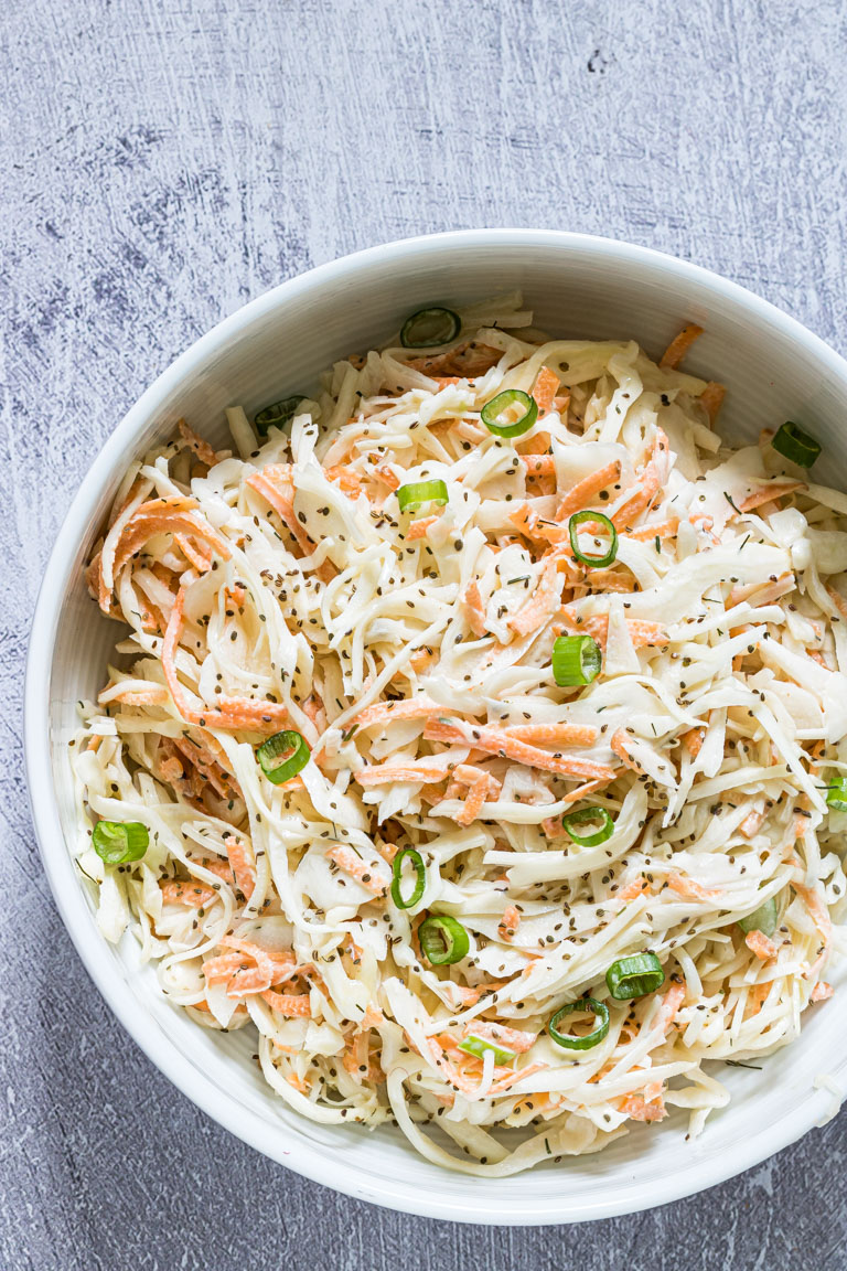 the completed southern coleslaw recipe in a blue ceramic bowl