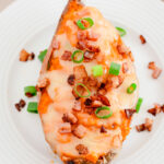 Twice baked sweet potatoes on a white plate.
